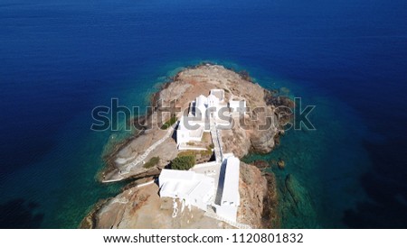 Aerial drone, bird's eye view of iconic church of Chrysopigi in picturesque island of Sifnos, Cyclades, Greece