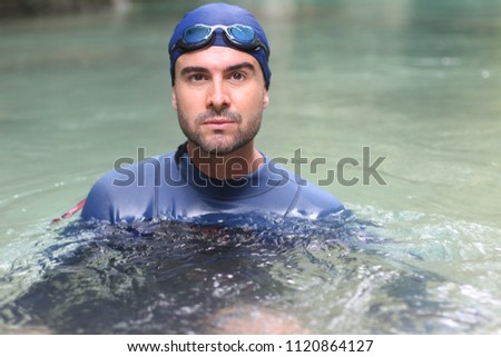 Swimmer in the water close up