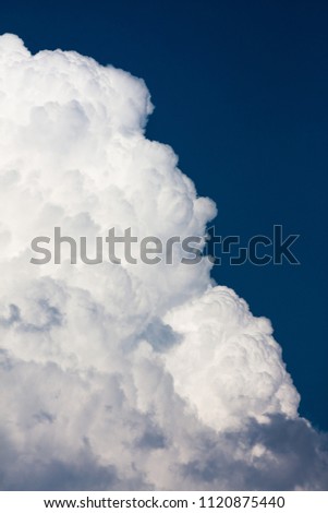 cumulus clouds in the sky before the storm