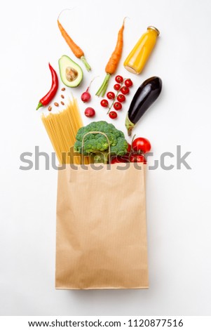 Image of paper bag with vegetables and spaghetti