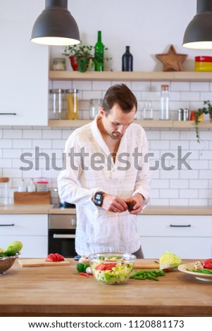 Image of brunet cooking dinner on table