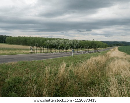 empty countryside road in early summer popular for motorcycling