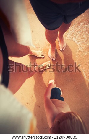 Family traveling concept/ Happy family on summer beach/selective focus