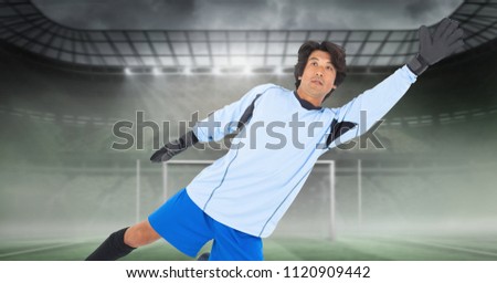 Digital composite of Soccer goalkeeper saving in goal