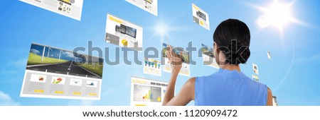 Digital composite of Composite image of woman touching digital files