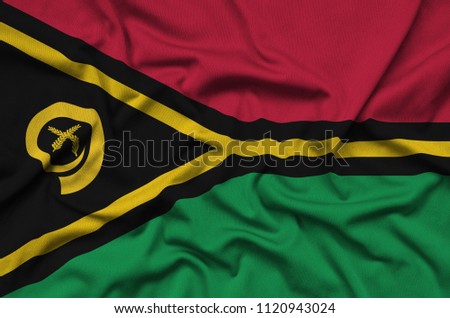 Vanuatu flag  is depicted on a sports cloth fabric with many folds. Sport team banner