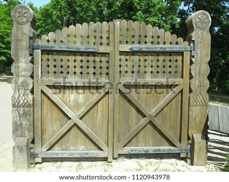 Ancient Rustic Old Wooden Gate with decorations Retro design.