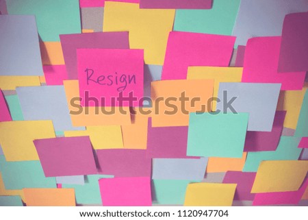 Resign sticky note on the center of many color note