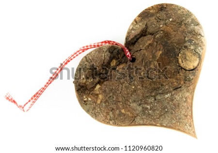 Wooden heart with cotton tag. Isolated on background.