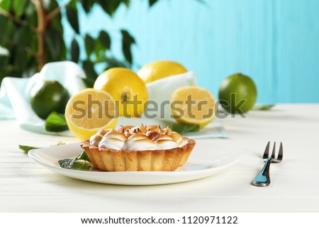 Lemon pie on a table on a blue background