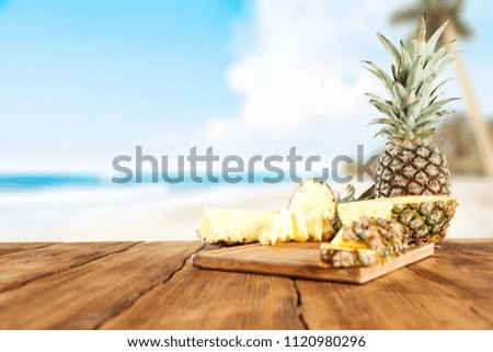 Fresh pineapple fruits and summer time on beach. 