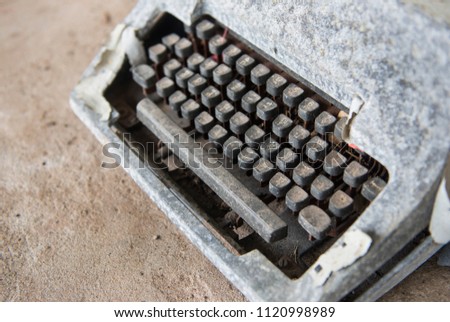 Part of retro old typewriter on concrete table front mint .Vintage style .