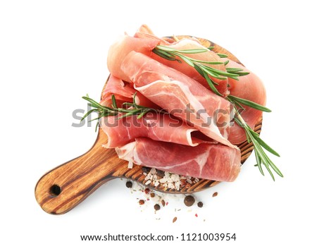Wooden board with prosciutto on white background Royalty-Free Stock Photo #1121003954