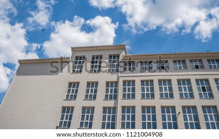 Old factory with blue cloudy sky background