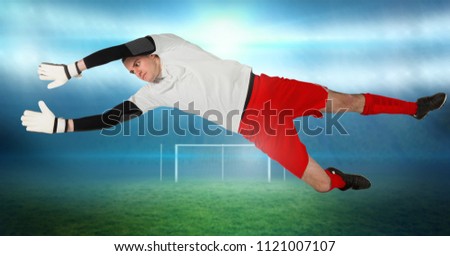 Digital composite of Soccer goalkeeper saving near goal