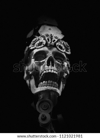 Skulls and terrible faces in the dark