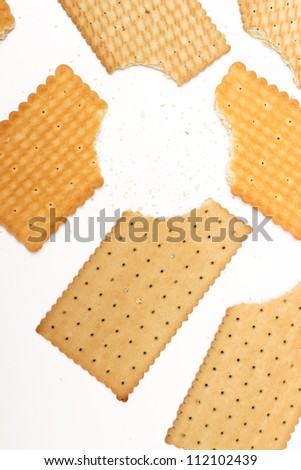 bitten off cookies on a white background Royalty-Free Stock Photo #112102439