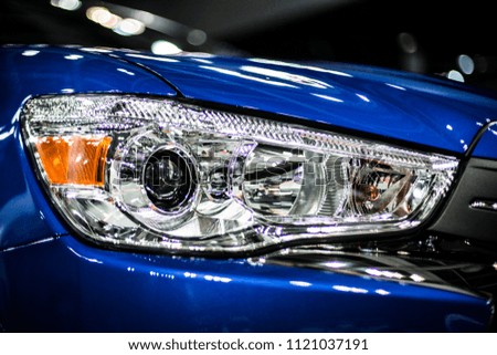 headlight of modern blue car with led and xenon optics