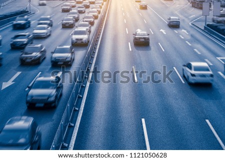 traffic on road in midtown of modern city