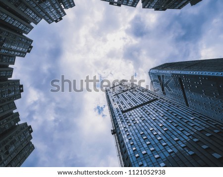 Low Angle Photography of A Group of Building under Blue Sky and White Clouds.