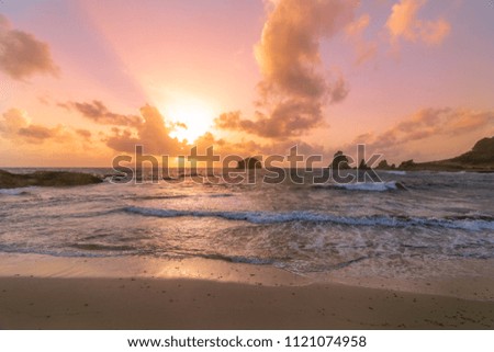 Colorful Sunrise on a Beach in a Tropical Island