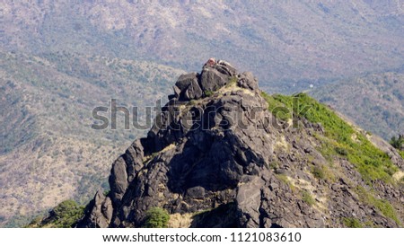 top view of girnar mountain from air, background wallpaper Royalty-Free Stock Photo #1121083610