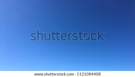 Beautiful blue sky with clouds background.Sky clouds.Sky with clouds weather nature cloud blue.Blue sky with clouds and sun. Pantone Classic Blue