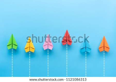 Paper plane on blue background, Business competition concept. Royalty-Free Stock Photo #1121086313
