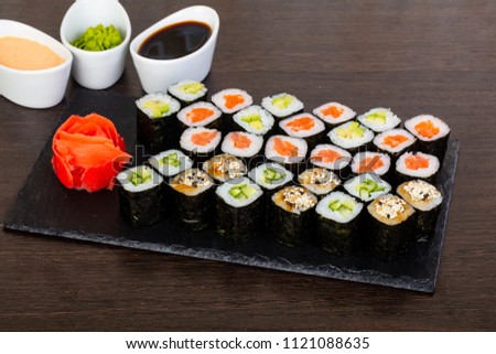 Delicious sushi set with avocado, cucumber and salted fish filling