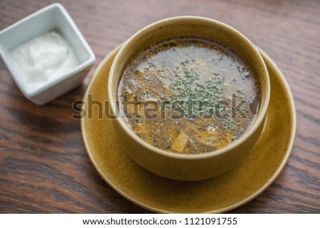 rich mushroom soup with vegetables and herbs