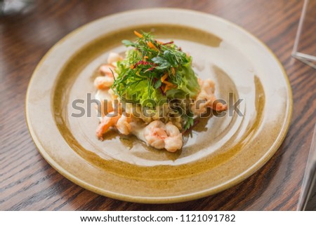 spring salad with herbs and boiled shrimps