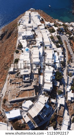 Aerial drone bird's view photo of iconic and picturesque village of Kastro featuring small chapel of Eptamartyres overlooking the Aegean sea, Sifnos island, Cyclades, Greece