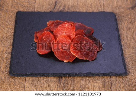 Dry pork meat heap over wooden