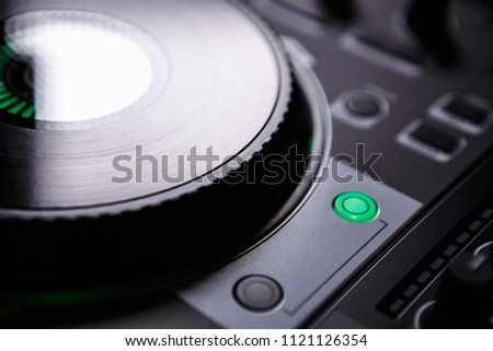 Dj cd player on stage in night club. Professional disc jockey turn table for playing music on party. Djs controller and sound mixer device. Curated collection of royalty free music images and photos