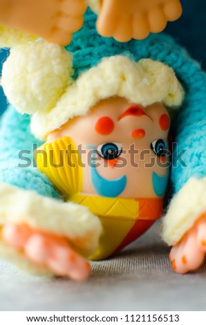 colorful clown somersault on the bed in selective focus