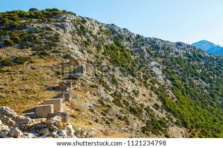 Ruins of encient windmills built in 15th century. Lassithi Plateau, Crete, Greece. Most typical characteristic of the Plateau.In the past they numbered thousands making up magnificent landscape.