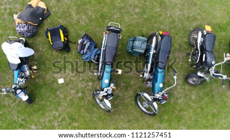 Aerial top down picture of classic mopeds are small motorcycles generally having less stringent licensing requirement than motorcycles colorful machines beautiful