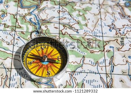 Compass and map. Navigation tools to avoid getting lost.