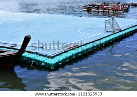 The soccer stadium and goalpost on the water in Koh Panyee. Floating football field in the sea water. The small fishing village in Phang Nga Province of Thailand.
