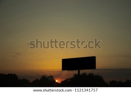 Warm colored sunset and add board