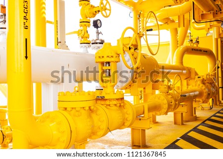 Offshore oil and Gas central processing platform and remote platform produced oil, natural gas and liquid condensate for set to onshore refinery from offshore in ocean sea background. Royalty-Free Stock Photo #1121367845