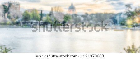 Defocused background with scenic view over the lake of EUR in Rome, Italy. Intentionally blurred post production for bokeh effect