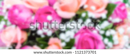 Defocused background with bouquet of roses. Intentionally blurred post production for bokeh effect