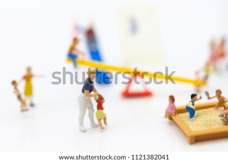 Miniature people : children playing together. Image use for happy family day concept.