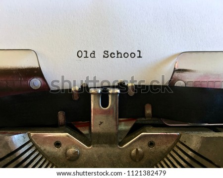 Old School, typewritten on white paper on vintage manual typewriter machine