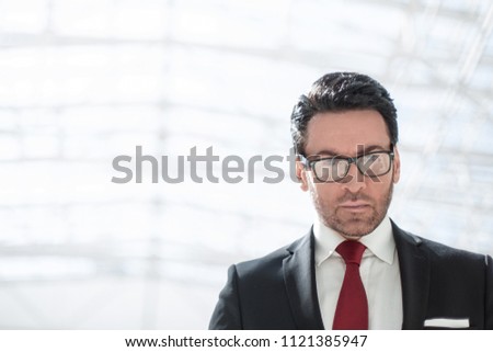 serious businessman looking at you
