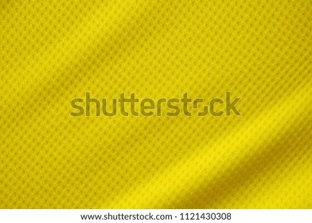 Yellow color football jersey clothing fabric texture sports wear background, close up