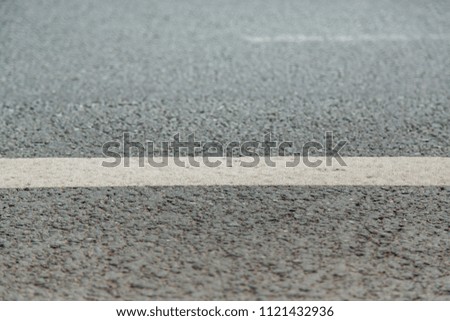 White strip on the road surface