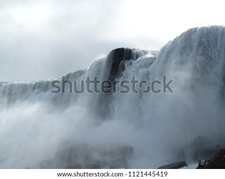 A section of the niagara falls showing of the power of the water. Royalty-Free Stock Photo #1121445419
