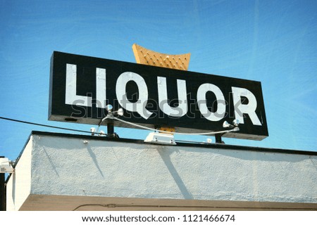 aged and worn neon liquor store sign